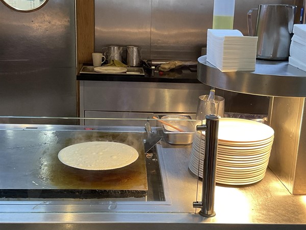 Image of plates being kept warm on a buffet