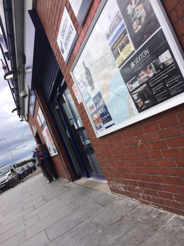 Level access into station with automatic doors.