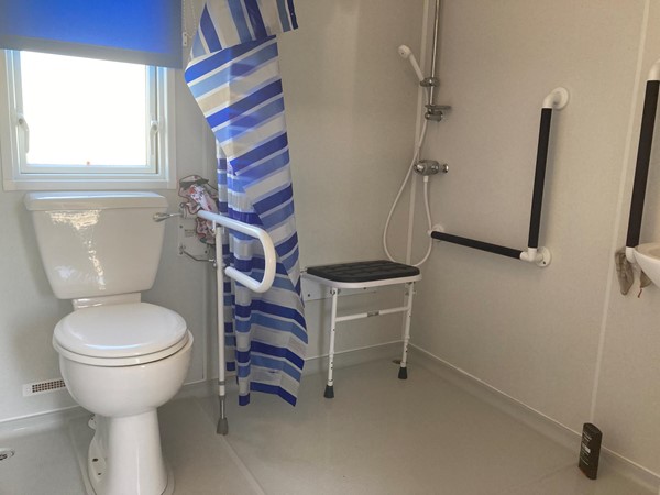 Wet room with fold up seat, making it easier for able and disabled people to be catered for