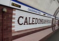 The platform wall with the station name spelt out in huge letters on the tiling.