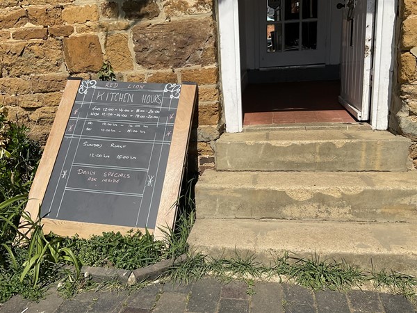 Image of a blackboard outside of a pub