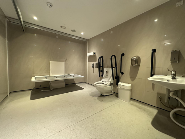 Image of large Changing Places accessible toilet with height-adjustable bench