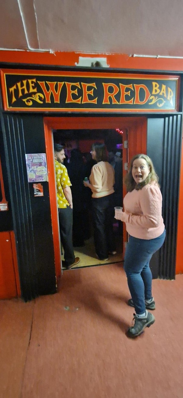 Image of someone standing in the doorway to the Wee Red Bar