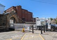 Image of entrance to station via car park and walkway