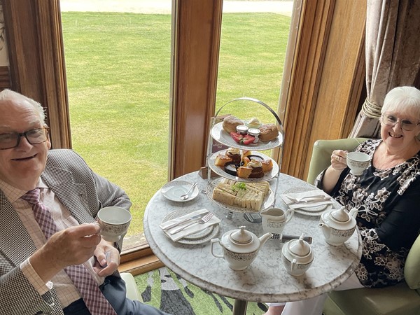 Image of two people seated at a table