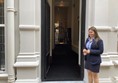 The entrance to the venue with a staff member outside.