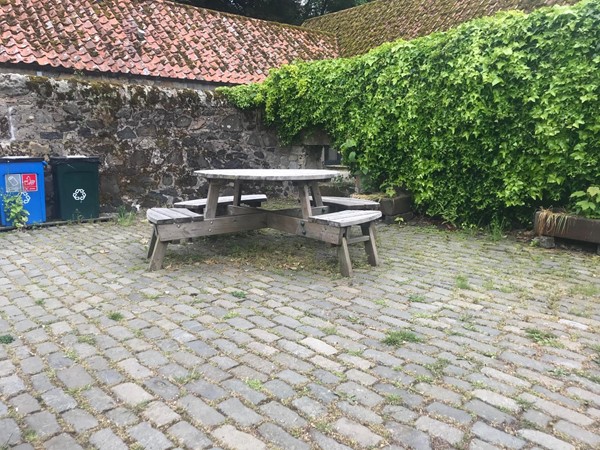 Image of one of the picnic benches that has wheelchair access.
