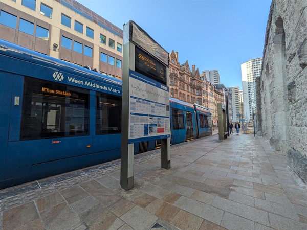image of tram at tram stop