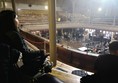 Wheelchair user sitting in the accessible area.