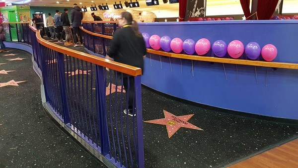 Wheelchair accessible ramp from reception up to the bowling lanes.