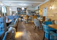 This is the dining room showing that there is plenty of space for wheelchairs