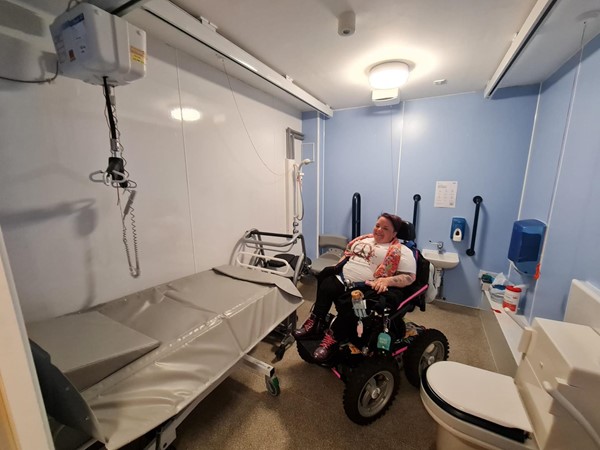 This makes the room look long and narrow but it's more square than that. This is an extremely large outdoor 4x4 wheelchair so the fact there is plenty of room for it to access all areas of the room and completely turn around in the middle is testament to how wide it really is.