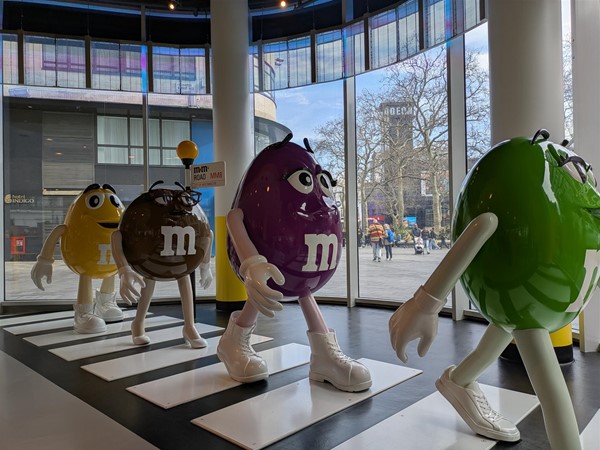 Image of M&M characters recreating the Beatles' Abbey Road image