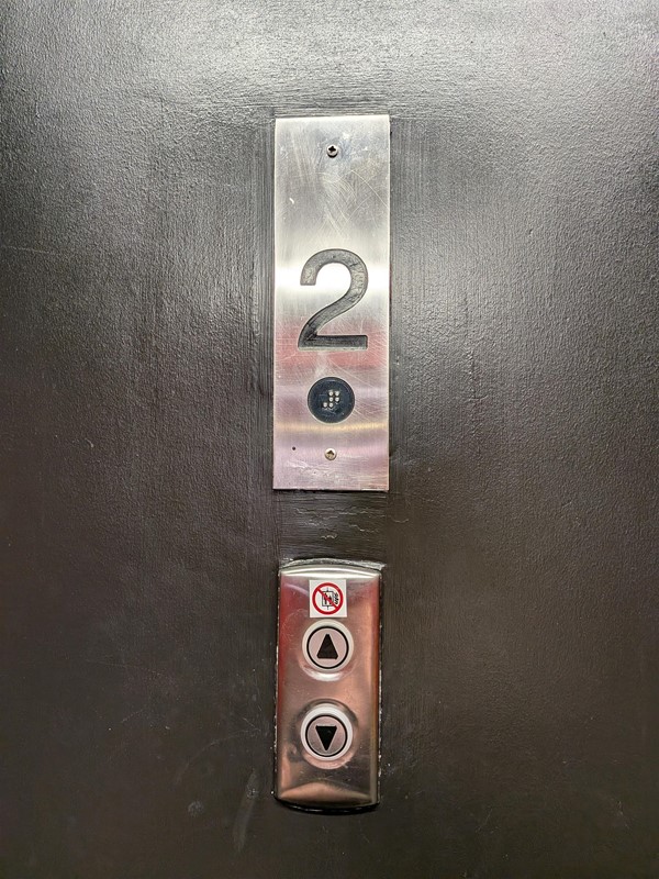 image of the level sign and lift call button on level 2