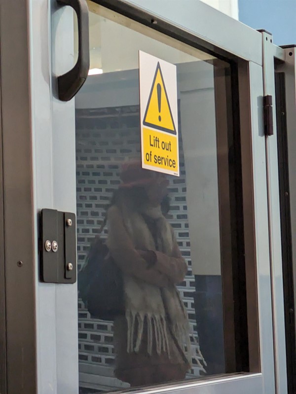 Image of the accessible lift with a 'Lift out of service' sticker.