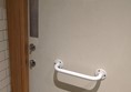 Picture of EAT - Usable accessible toilet, but the door has a door handle and two locks as well.