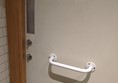 Picture of EAT - Usable accessible toilet, but the door has a door handle and two locks as well.