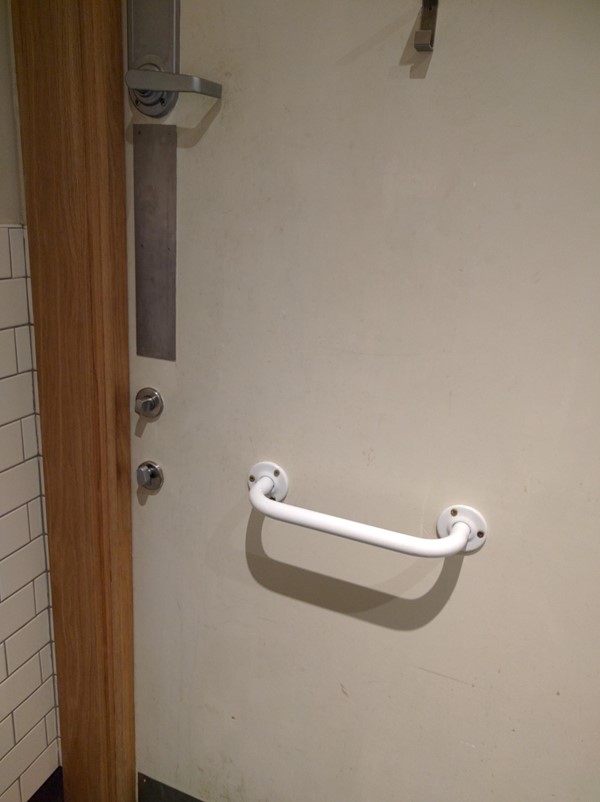 Picture of EAT - Usable accessible toilet, but the door has a door handle and two locks as well.