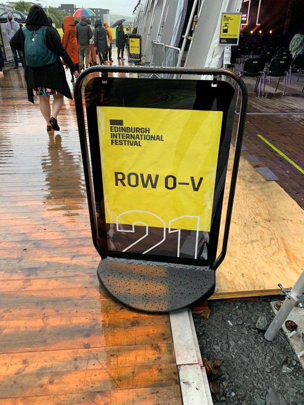 Picture of a sign saying row o to v