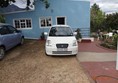 Picture of Impangele Gust House - As you can see, the parking area isn't too nice but the owners give preference to wheelchair users and ask other guests to do the same ... that's our car :)