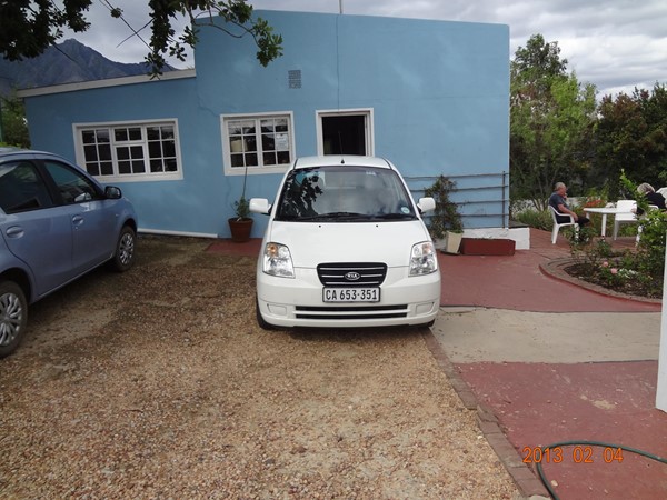 Picture of Impangele Gust House - As you can see, the parking area isn't too nice but the owners give preference to wheelchair users and ask other guests to do the same ... that's our car :)