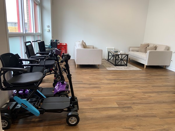 image of the sofa and mobility scooters on display