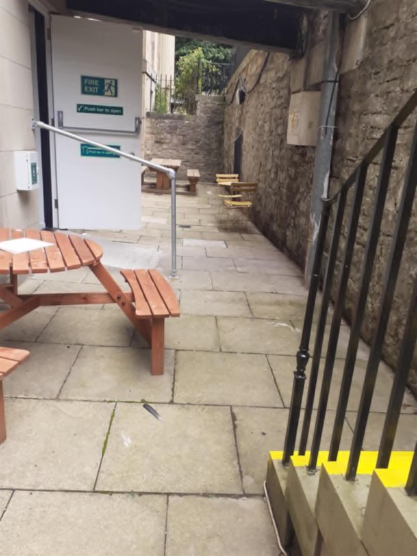 Outside seating, with a view of the steps (they are brightly marked with yellow paint, but don't worry, there is a lift at the adjacent entrance).