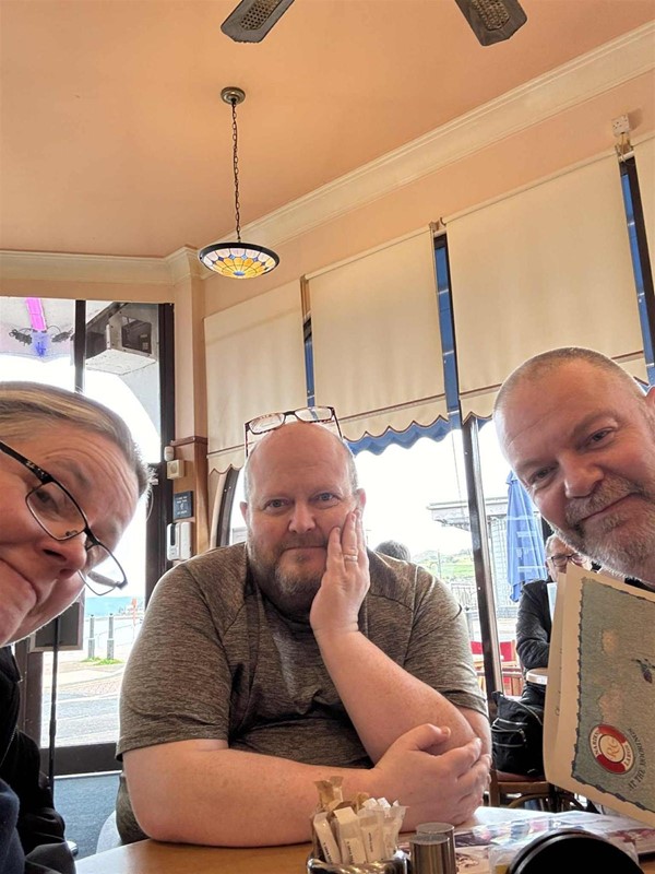Image of three people at a table
