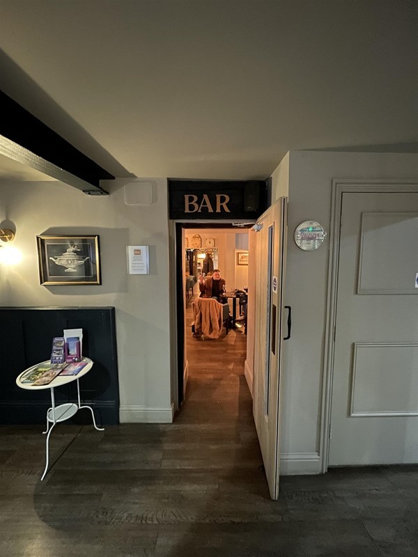 Image of a view into the bar through a door