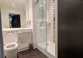 Image of toilet seat and shower