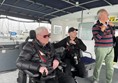 Image of three people on a boat