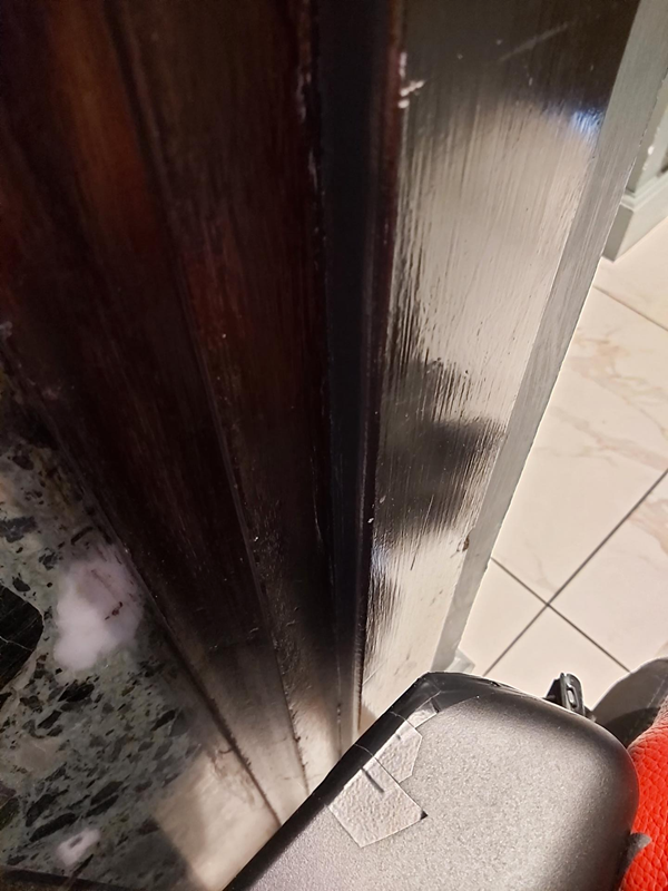 Space between my chair and the doorframe on the left.