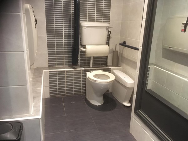 Wheelchair accessible toilet. Note limitations on transfer area and turning space.