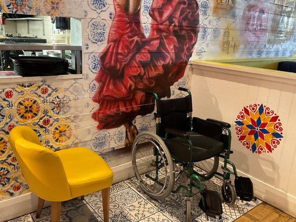 Image of wheelchair and seat in dining area