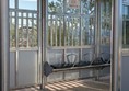 Image of rain shelter and bench seating with armrests