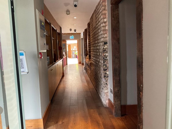A long passage that is wide enough for chairs