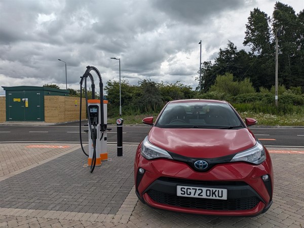 Image of red car in charging bay