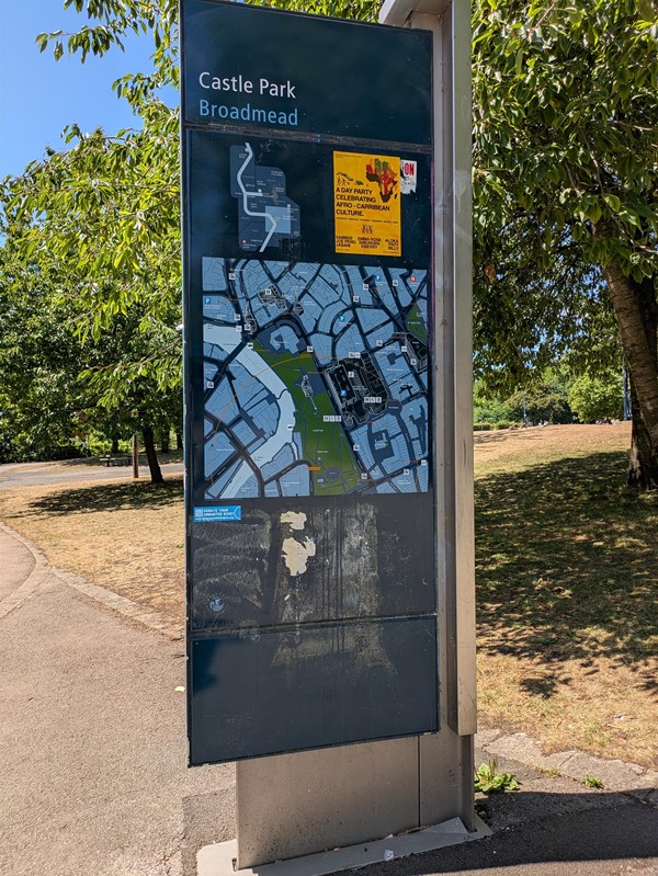 Image of signage fo Castle Park showing current location and routes through the park