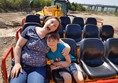 Ride with seats in a digger scoop