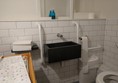 The disabled toilet as seen from the door.