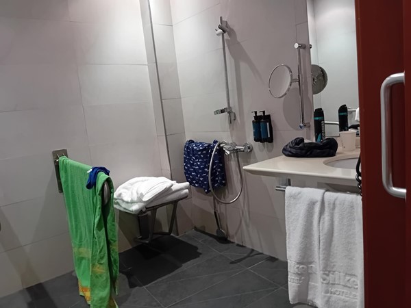 Image of a bathroom with a sink and towels