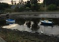 Photo of boats where the river meets the coast.