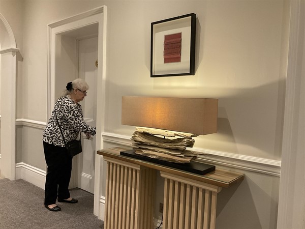 Image of a person in a corridor.
