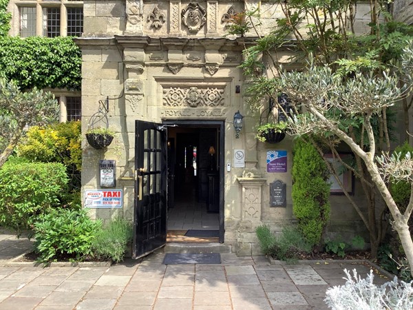 Picture of the hotel door with a taxi sign