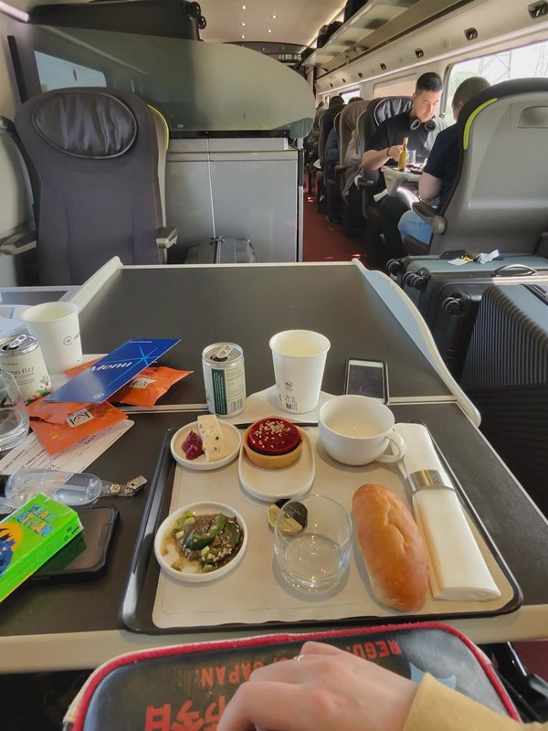 Image of food on a table on a train