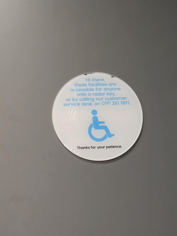Image of signage on door to the accessible toilet
