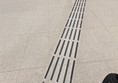 Image of tactile markings leading to bus gates