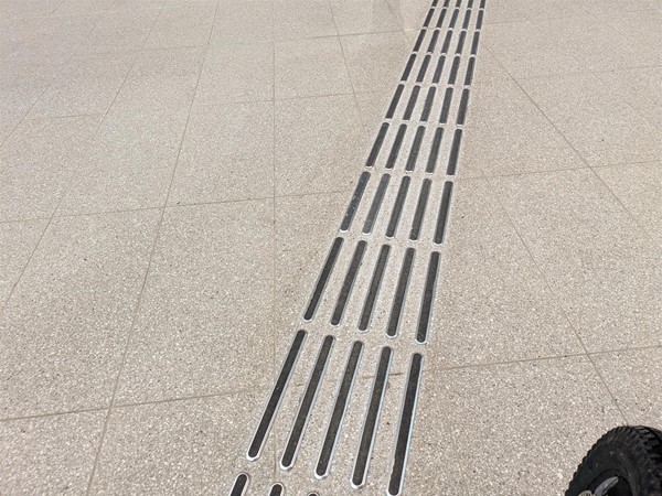 Image of tactile markings leading to bus gates