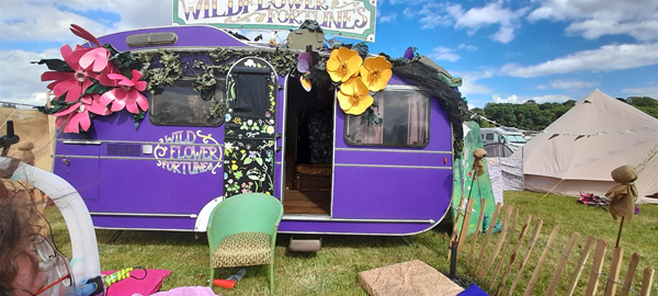 Image of a purple caravan