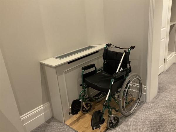 Image of a wheelchair in a room.